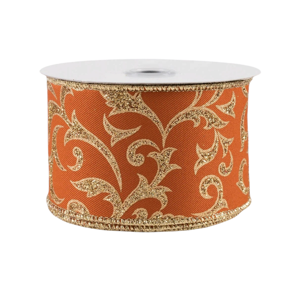 The Matthew John Collective 2.5 inch wired autumn orange ribbon featuring a metallic gold glitter acanthus leaf pattern.