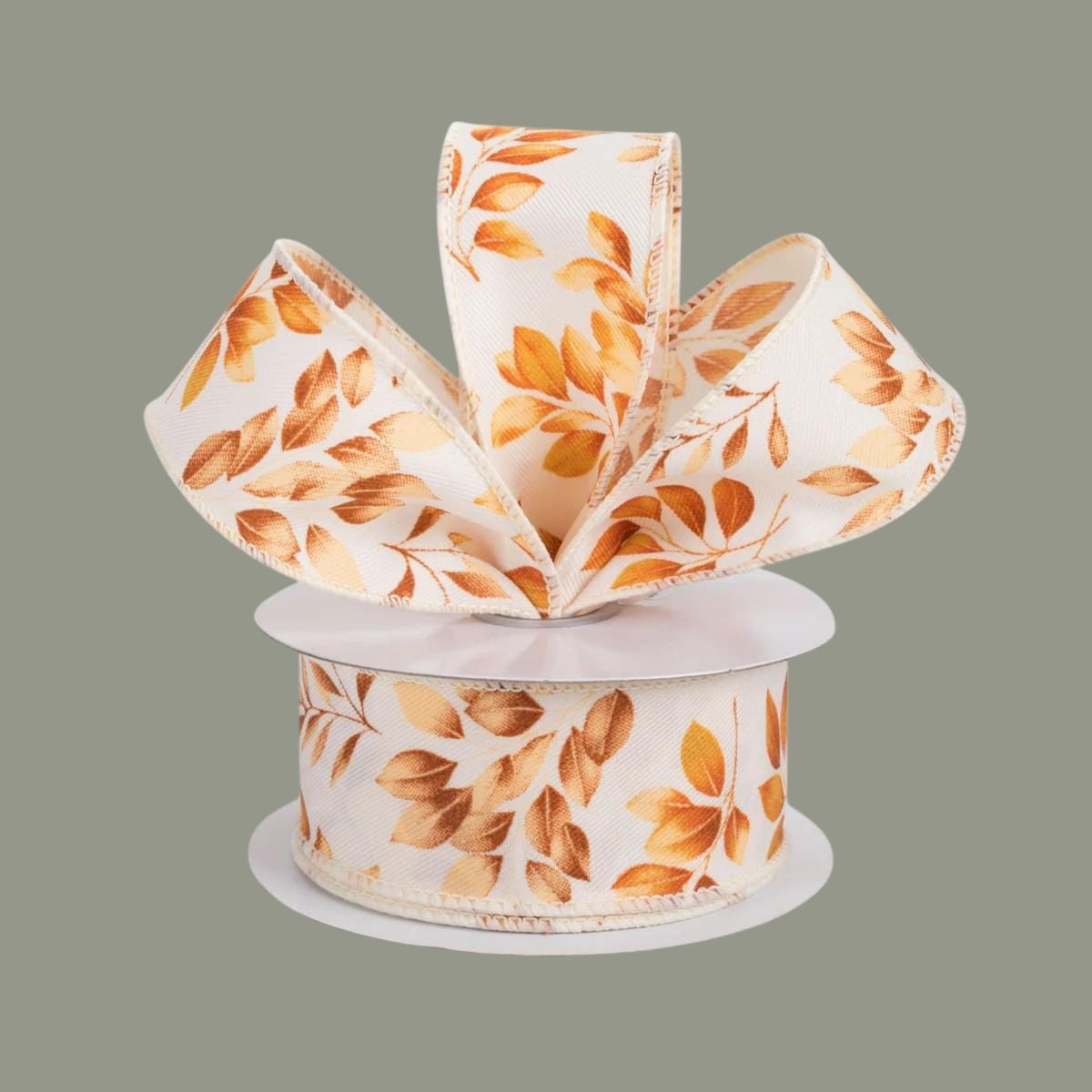 The Matthew John Collective ivory canvas ribbon with brown and orange autumn leaf print and wired edges.