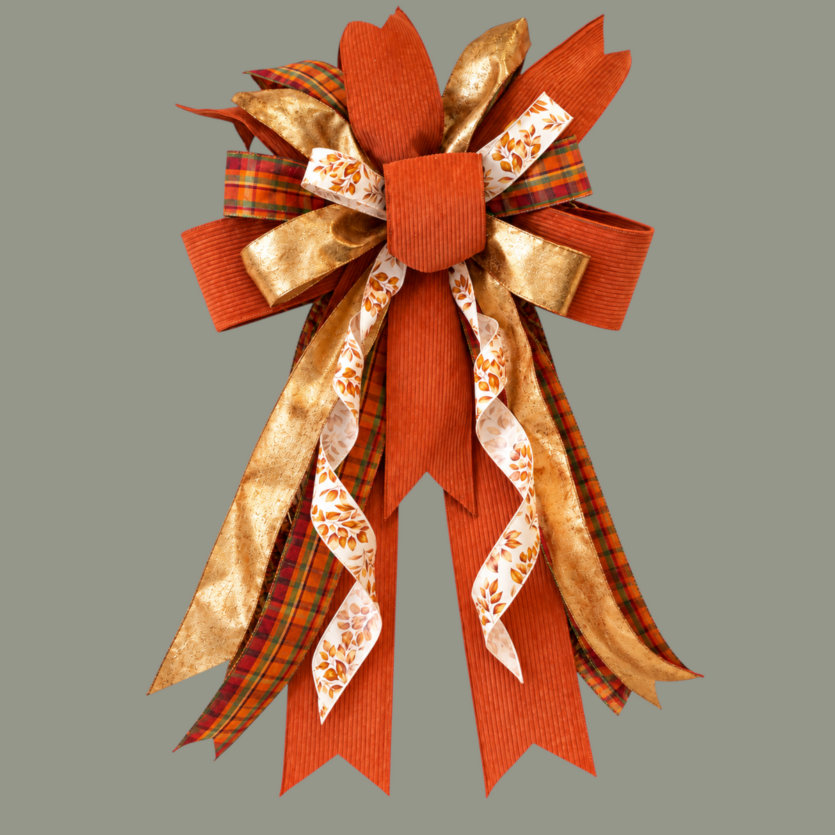 The Matthew John Collective Golden Harvest Wreath bow featuring burnt orange corduroy, metallic gold, and plaid ribbon.