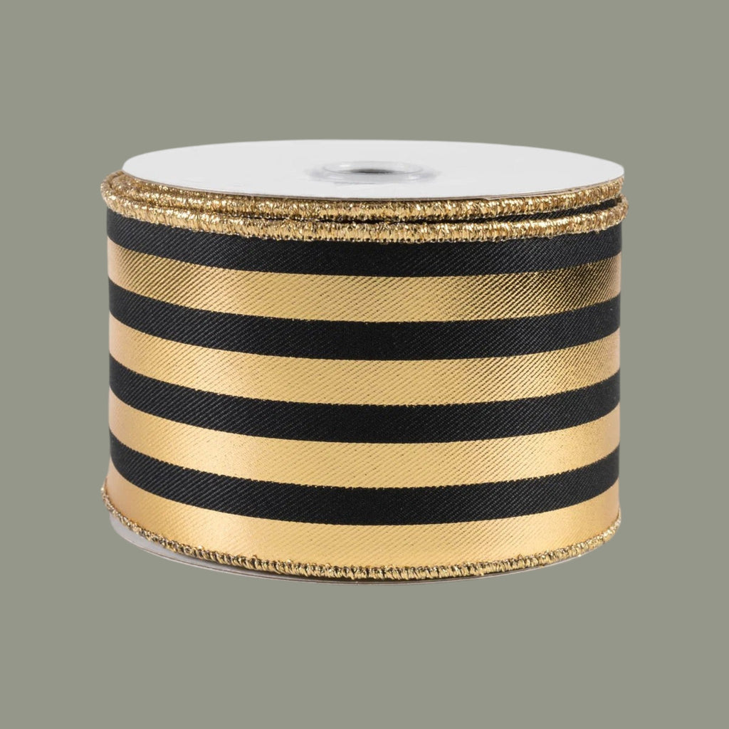The Matthew John Collective black and gold metallic striped wired canvas ribbon on a spool for decorative crafts.