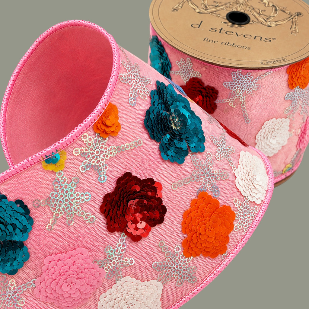 The Matthew John Collective D Stevens blush pink wired ribbon featuring dimensional metallic sequin floral patterns.