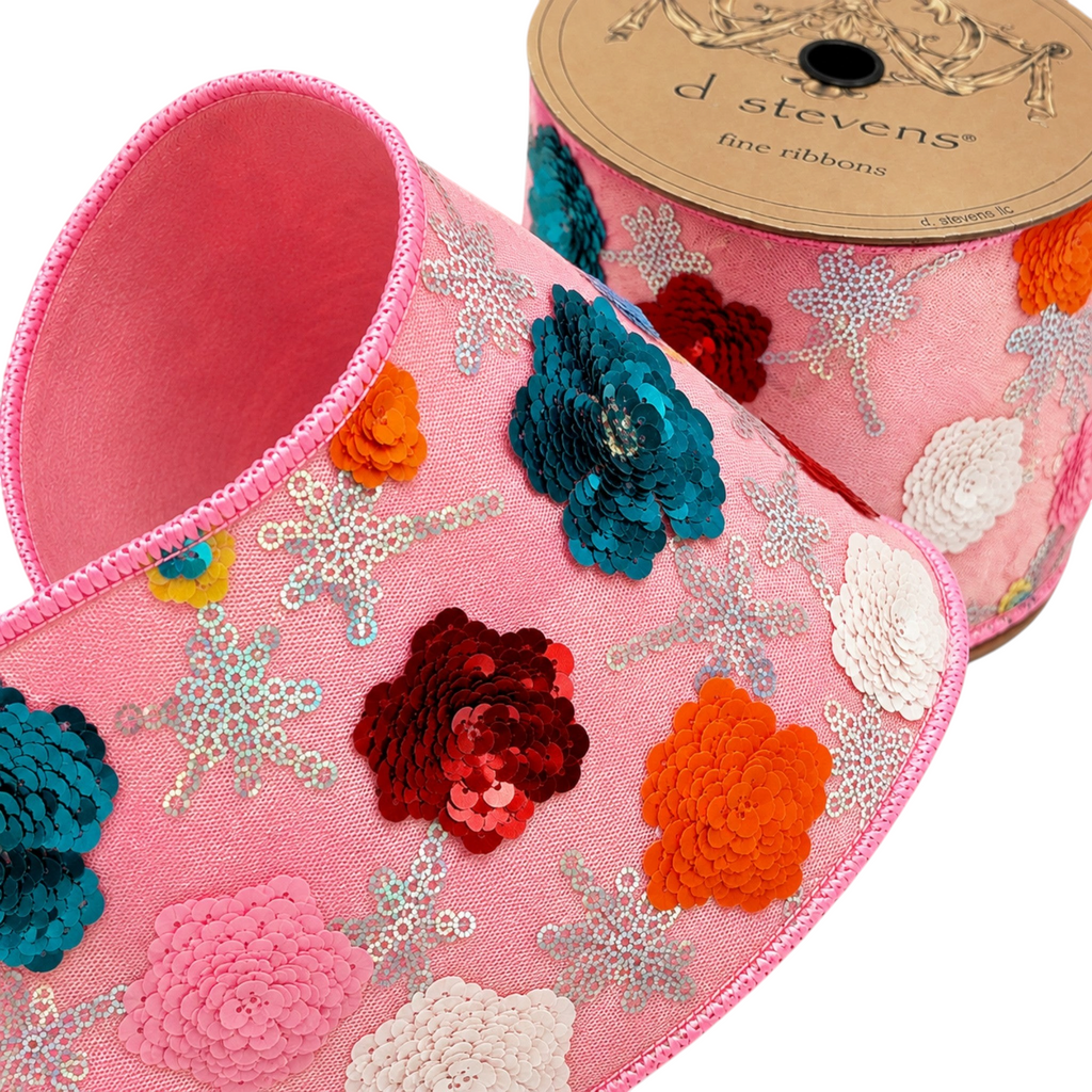 The Matthew John Collective D Stevens blush pink wired ribbon featuring dimensional metallic sequin floral patterns.