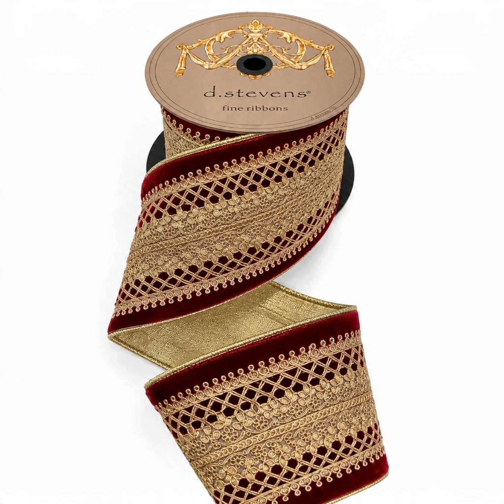 The Matthew John Collective D. Stevens burgundy velvet ribbon with ornate gold Baroness lace center trim on a spool.