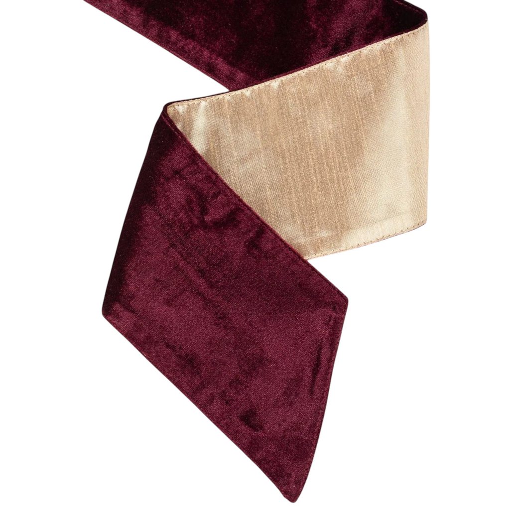 The Matthew John Collective burgundy velvet and gold satin double-sided wreath sash with pointed ends.