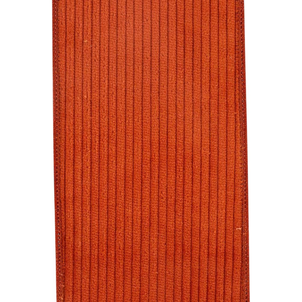 The Matthew John Collective burnt sienna corduroy wired ribbon with a mesh backing and textured cotton ridges.