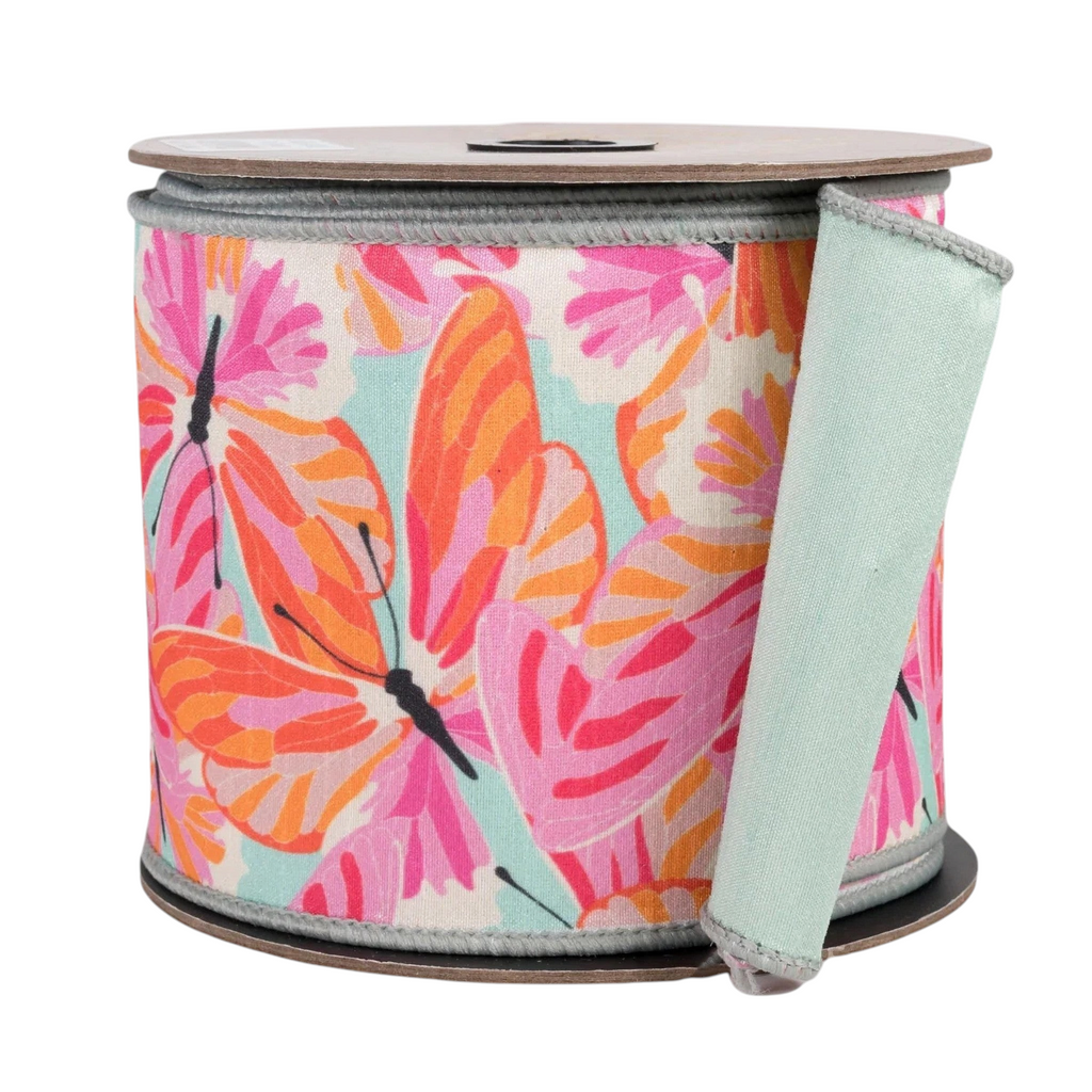 The Matthew John Collective 4-inch dupioni ribbon featuring orange and pink butterflies on a celadon green background.