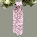 The Matthew John Collective D. Stevens hot pink and white chinoiserie sash tied on a decorative greenery wreath