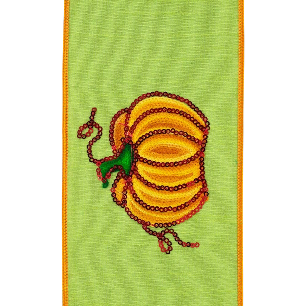 The Matthew John Collective citrus green ribbon featuring a sequined pumpkin design and an orange wired edge.
