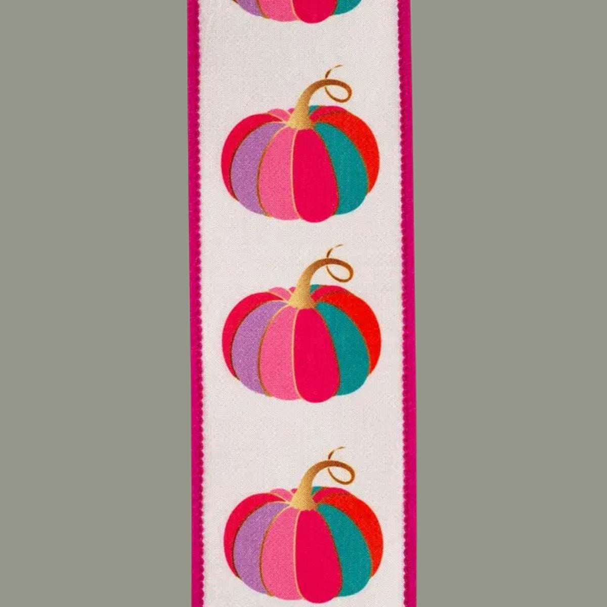 The Matthew John Collective 2.5 inch wired ribbon featuring colorful pumpkin print on white with fuchsia edges