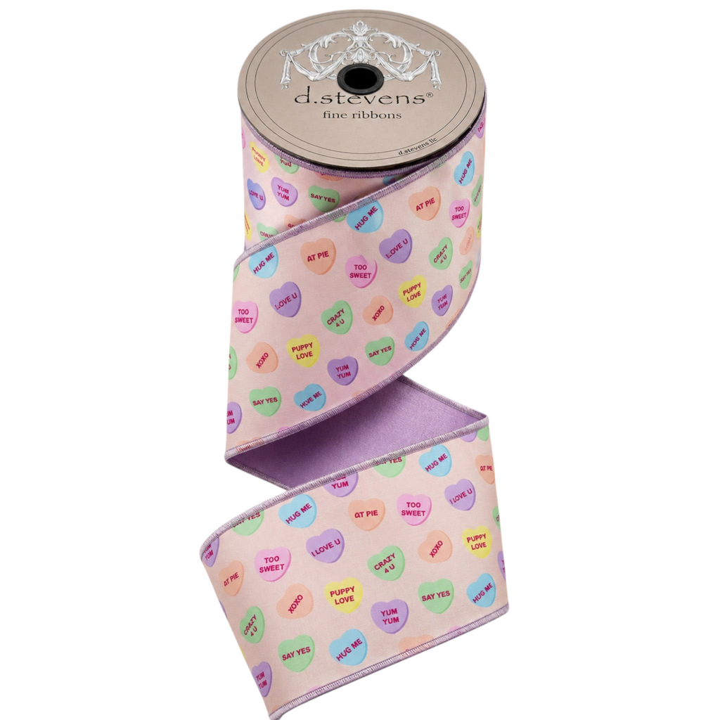 The Matthew John Collective D Stevens satin ribbon with pastel conversation hearts on a blush background and wired edges