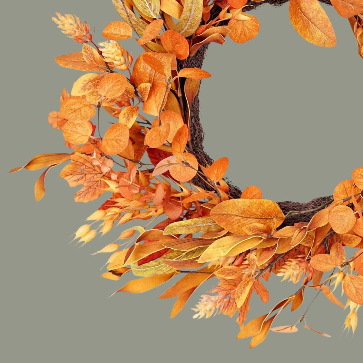 The Matthew John Collective 21-inch fall garden wreath featuring layered autumn leaves and seasonal foliage textures.