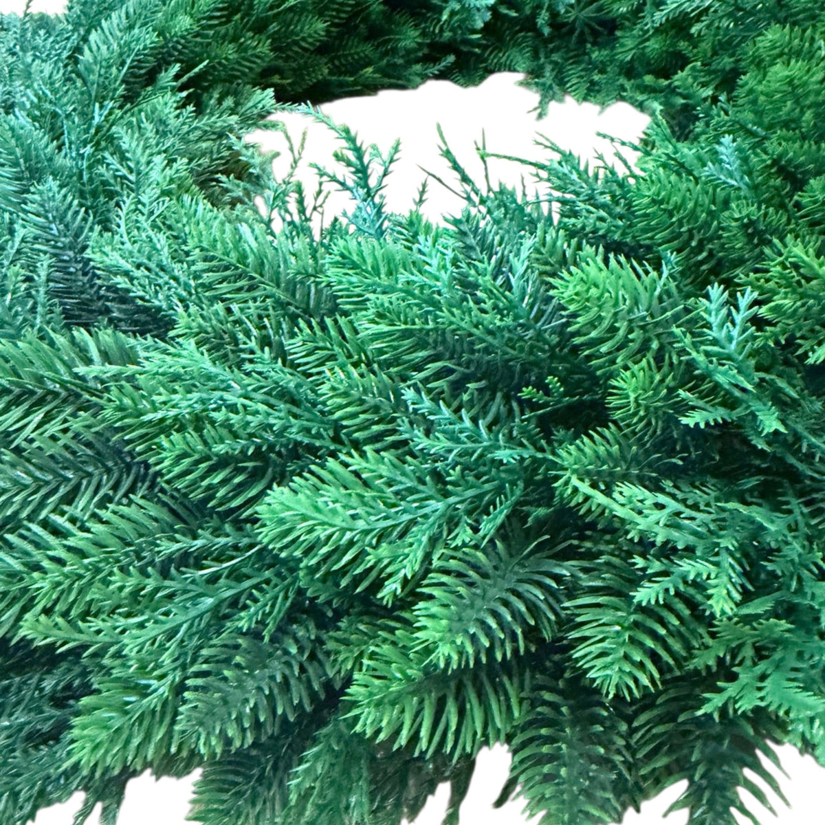 The Matthew John Collective 22-inch round mixed evergreen wreath with realistic faux cedar and pine foliage textures.