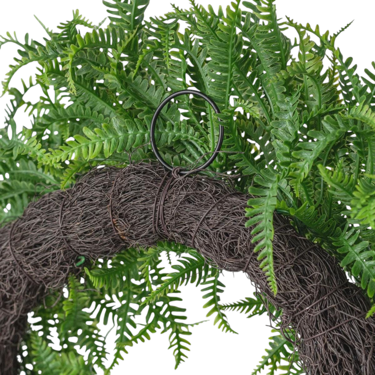 The Matthew John Collective 18-inch artificial fern wreath featuring green plastic fronds on a rustic angel vine frame.