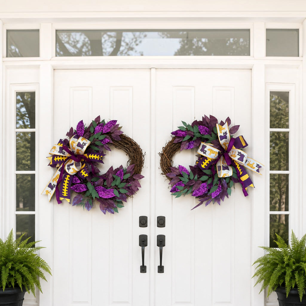 The Matthew John Collective Death Valley double door football wreaths with purple foliage and tiger print bows.