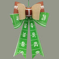 The Matthew John Collective 25-inch football tailgate bow with green field ribbon and a central football accent.