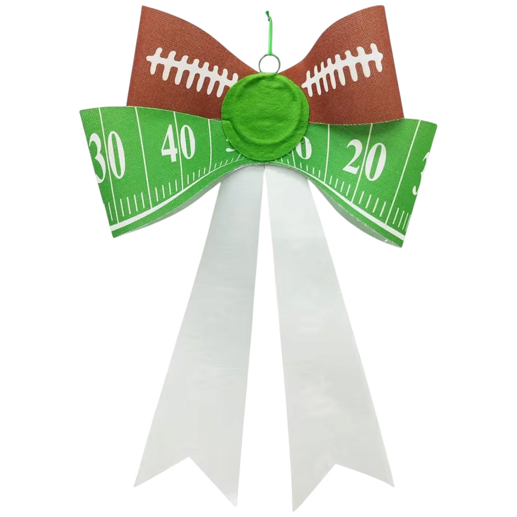 The Matthew John Collective 25-inch football tailgate bow featuring green field ribbon, brown football accents, and white tails.
