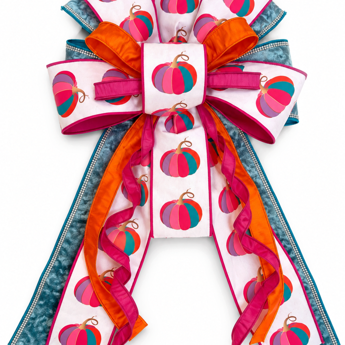 The Matthew John Collective oversized fall wreath bow with fuchsia pumpkin print, blue velvet, and rhinestone edges.