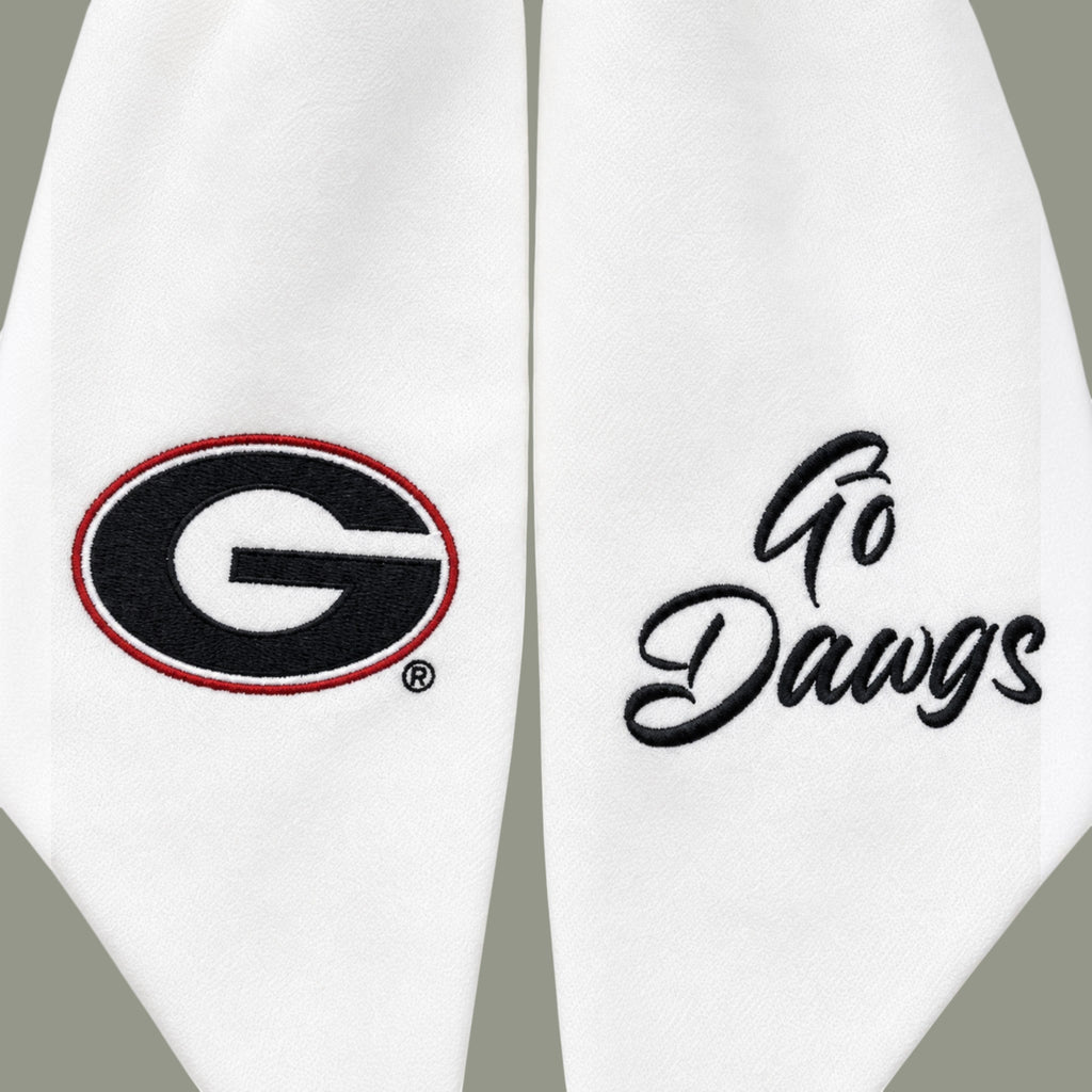 The Matthew John Collective white Georgia wreath sash featuring embroidered team logo and Go Dawgs script text.