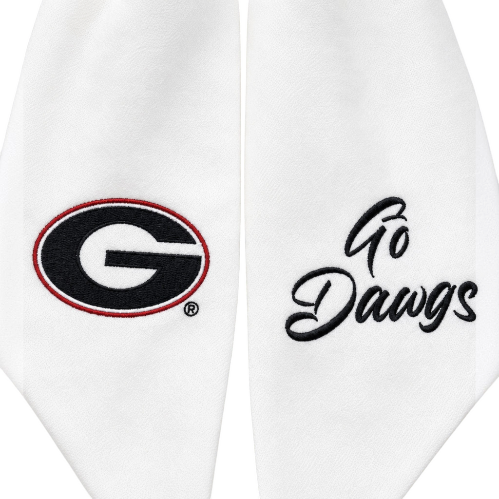 The Matthew John Collective white Georgia wreath sash featuring embroidered team logo and Go Dawgs script text.