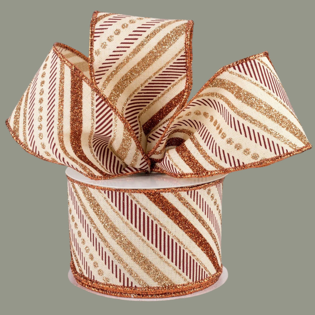 The Matthew John Collective cream canvas ribbon with diagonal glitter stripes in copper, champagne, and burgundy.
