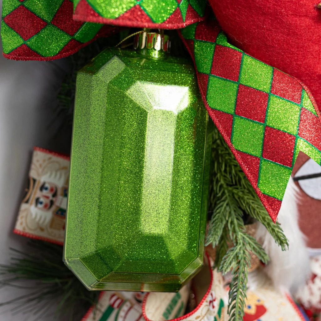 The Matthew John Collective emerald green rectangular glitter gem ornament with faceted surfaces and gold hanging loop.