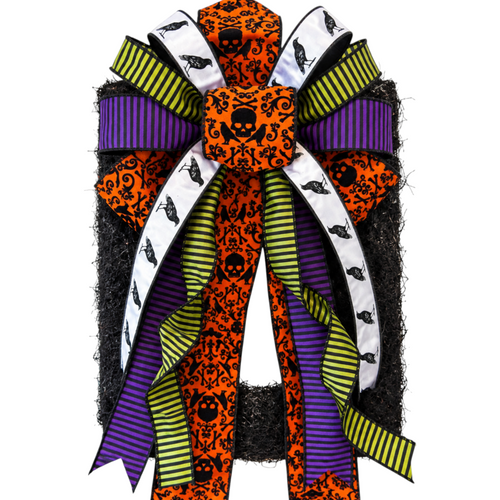 The Matthew John Collective oversized Halloween bow with Beetlejuice inspired ribbon, orange, purple, and black crows.