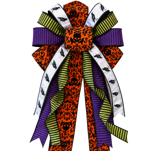 The Matthew John Collective oversized Halloween bow with Beetlejuice inspired stripes, orange skull print, and crows.