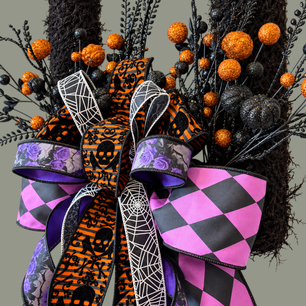 The Matthew John Collective Midnight Masquerade Halloween wreath with a designer bow, glittered orange spheres, and foliage