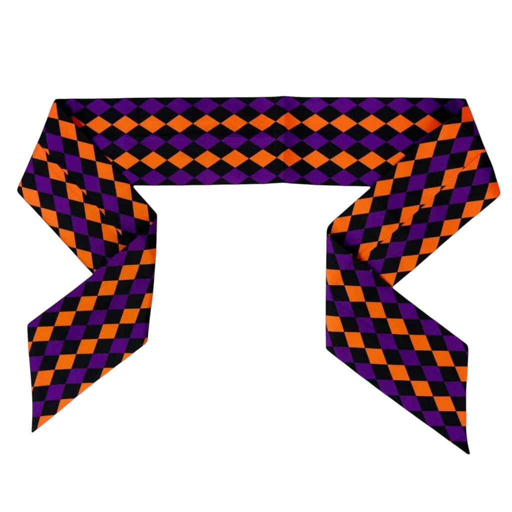 The Matthew John Collective D Stevens taffeta wreath sash featuring a black, purple, and orange harlequin diamond print.