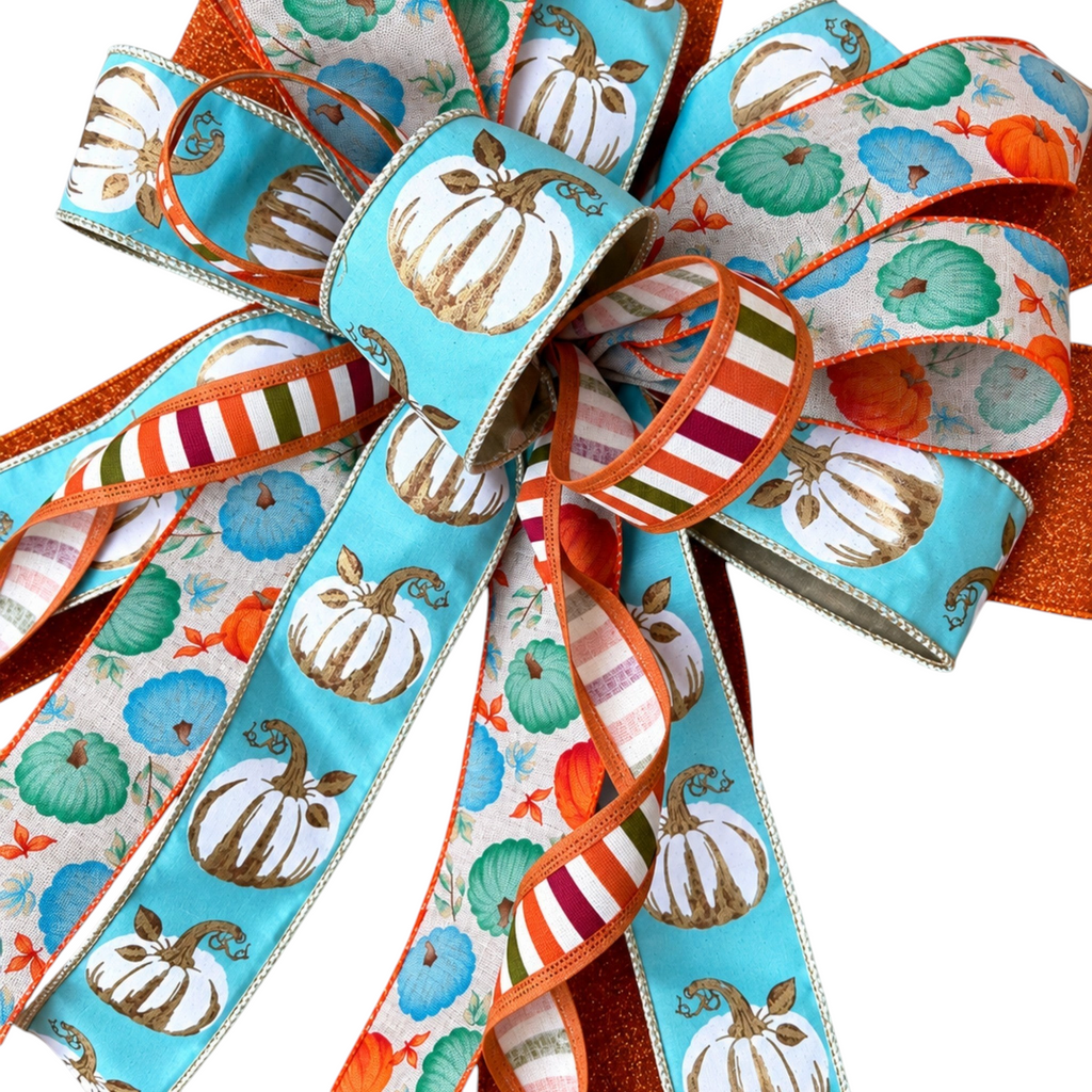 The Matthew John Collective Harvest Blues wreath bow featuring aqua, burnt orange, and cream pumpkin print wired ribbons.