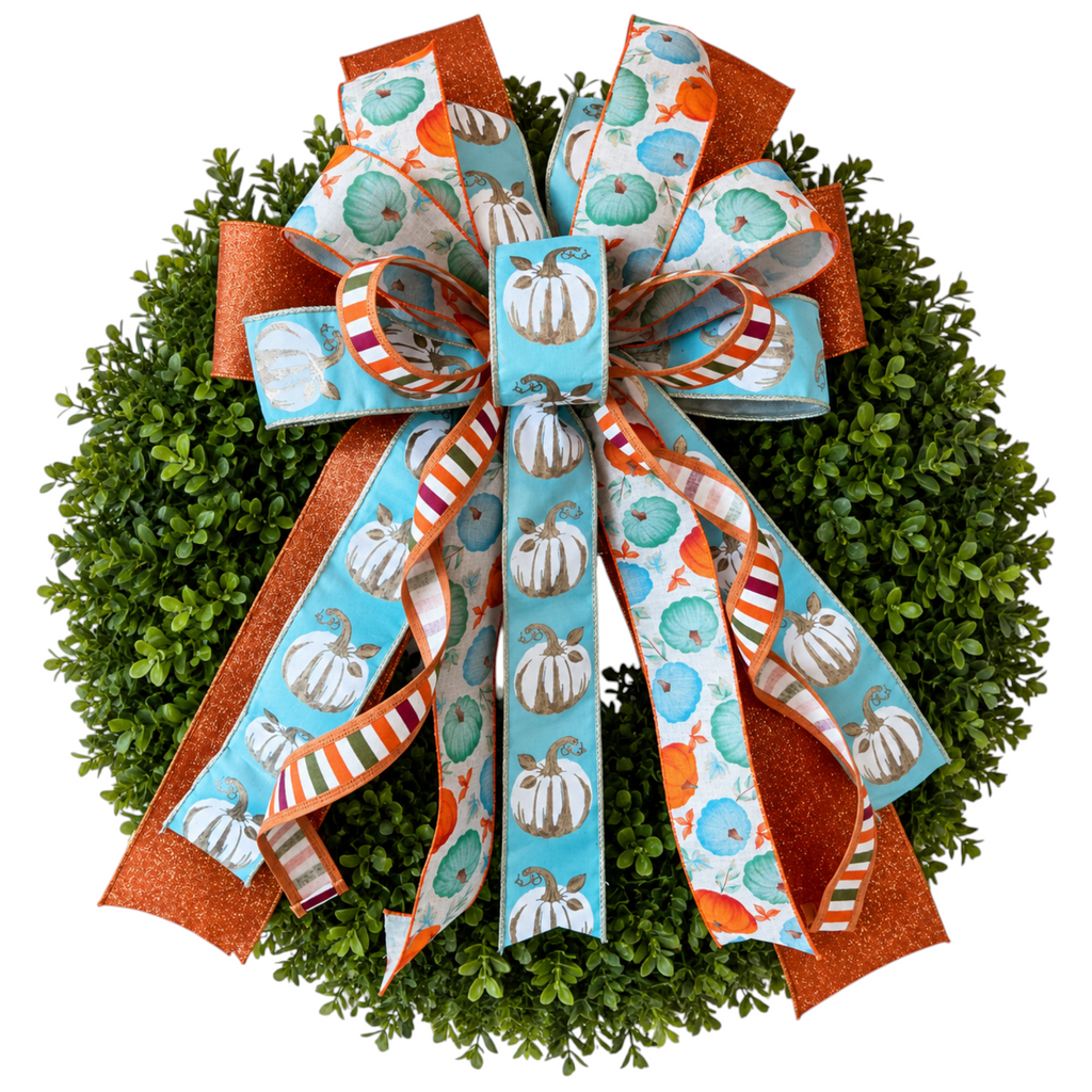 The Matthew John Collective Harvest Blues wreath bow featuring aqua, orange, and cream pumpkin print wired ribbons.