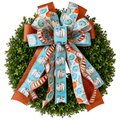 The Matthew John Collective Harvest Blues wreath bow featuring aqua, orange, and cream pumpkin print wired ribbons.