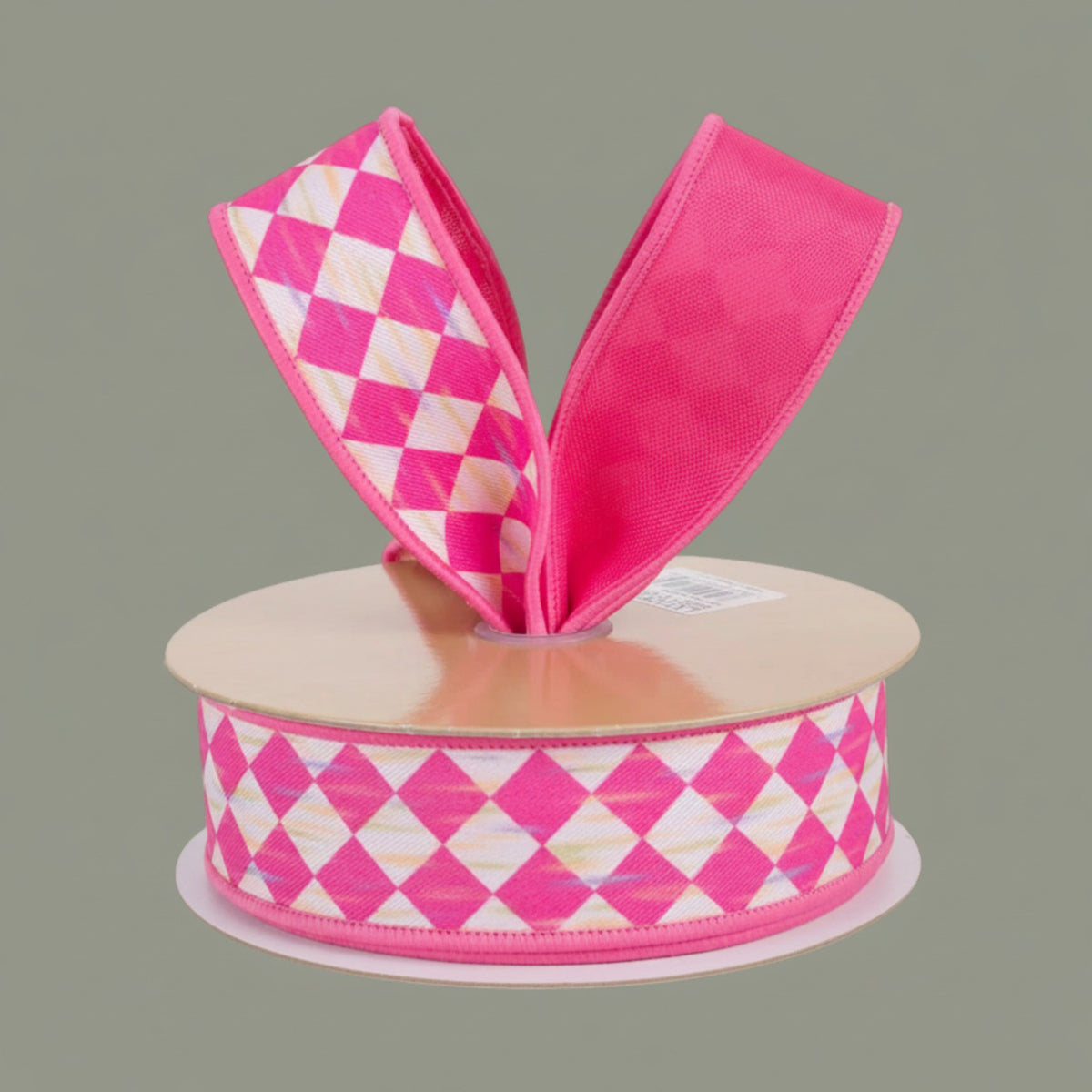 The Matthew John Collective 1.5 inch wired ribbon in hot pink and white with an antique diamond harlequin pattern.