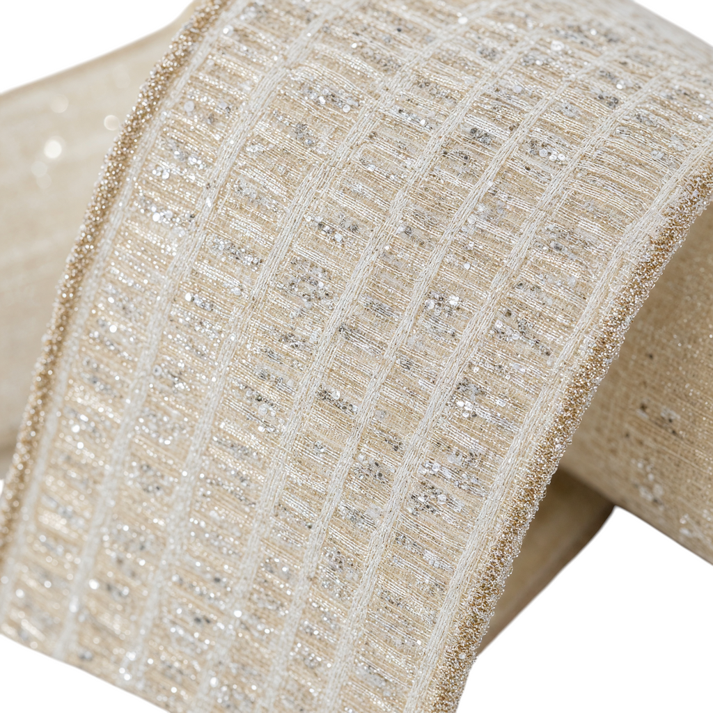 The Matthew John Collective Farrisilk ivory holiday ribbon with shimmering silver tinsel louvers and metallic edges.