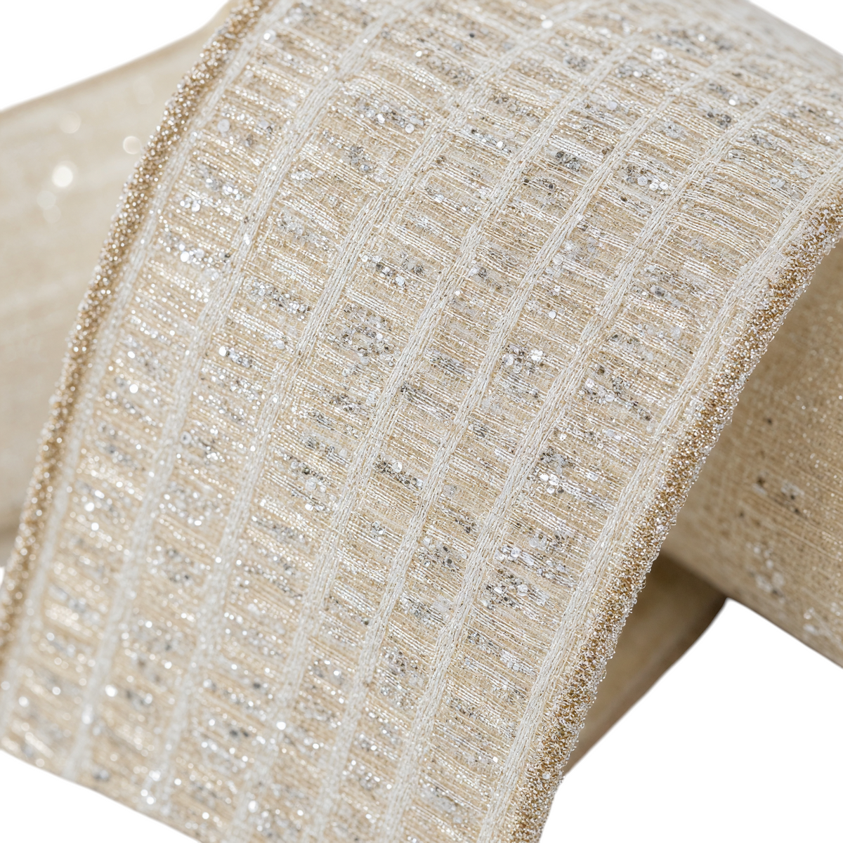 The Matthew John Collective Farrisilk ivory holiday ribbon with shimmering silver tinsel louvers and metallic edges.