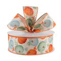 The Matthew John Collective 2.5 inch wired linen ribbon featuring orange and teal pumpkins on a natural beige base.