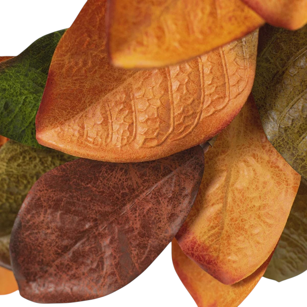 The Matthew John Collective 22-inch magnolia leaf wreath featuring variegated olive, orange, and burgundy fall foliage.