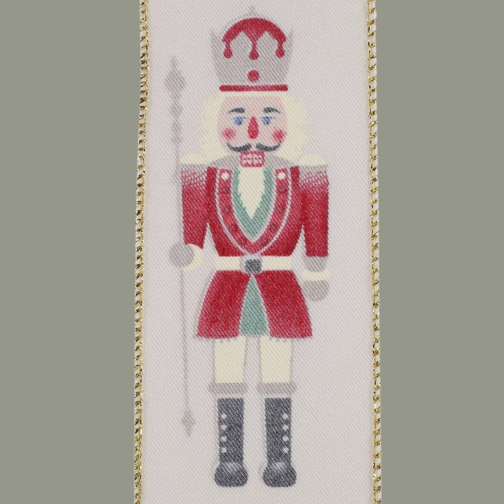 The Matthew John Collective ivory wired ribbon featuring a festive nutcracker soldier in red, green, and gold.