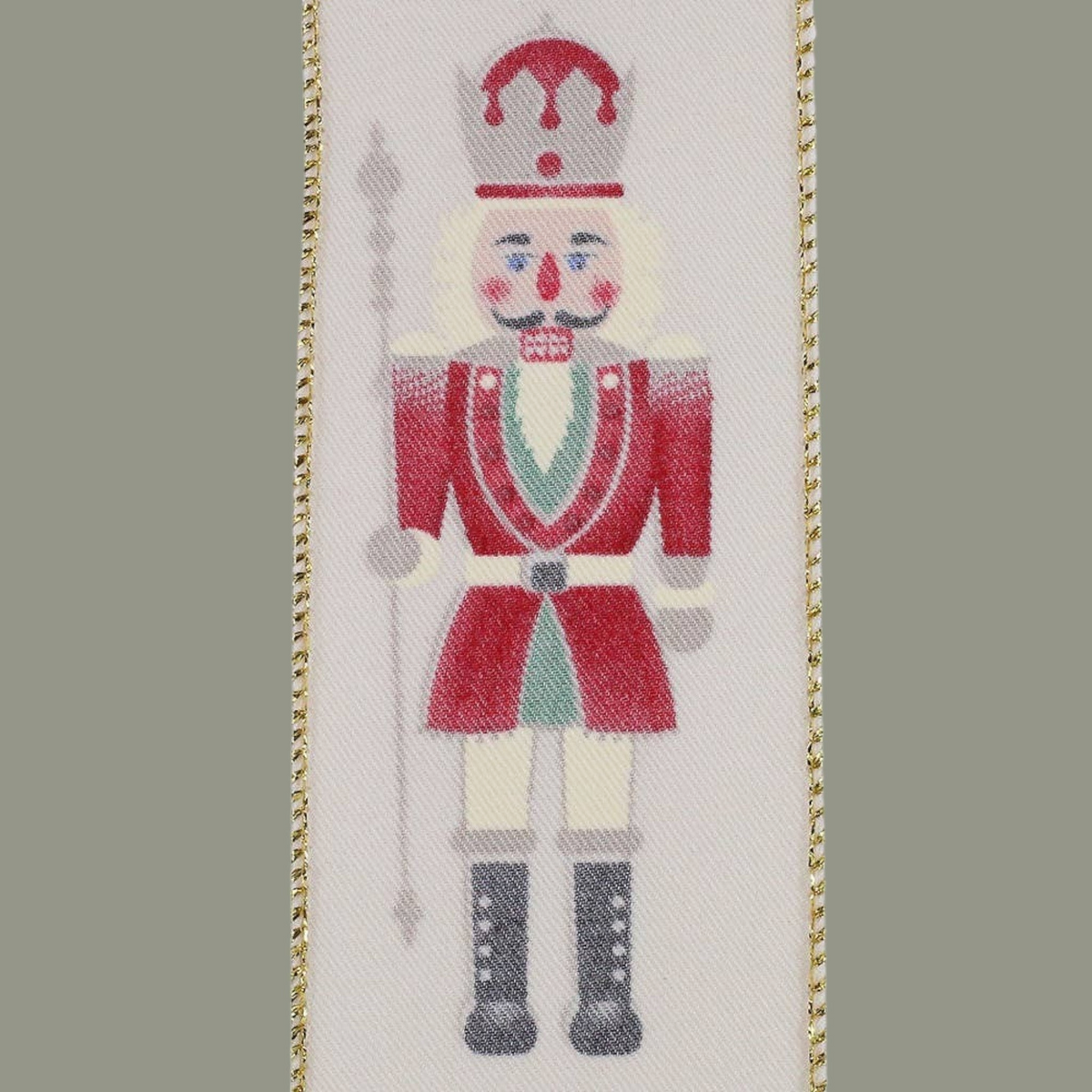 The Matthew John Collective ivory wired ribbon featuring a festive nutcracker soldier in red, green, and gold.