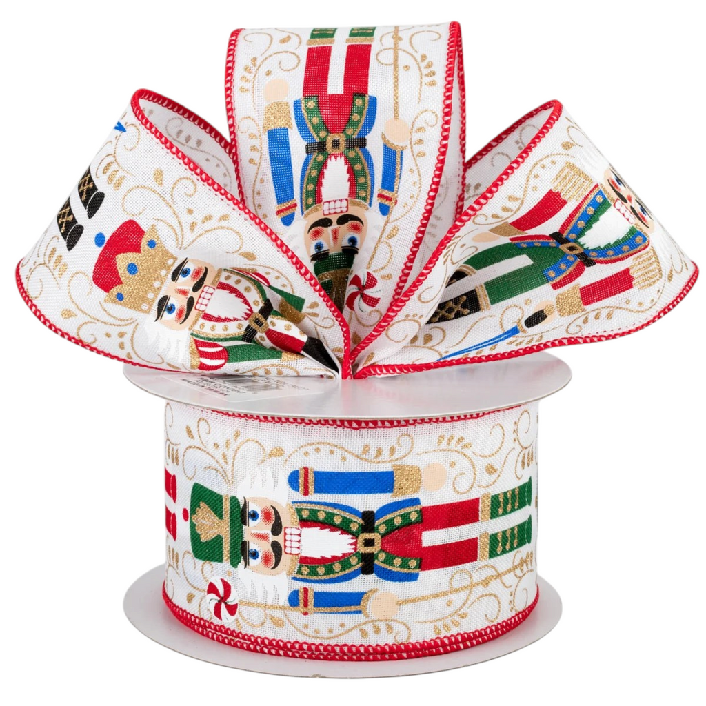 The Matthew John Collective nutcracker wired ribbon on a white canvas with red, green, and gold festive details.