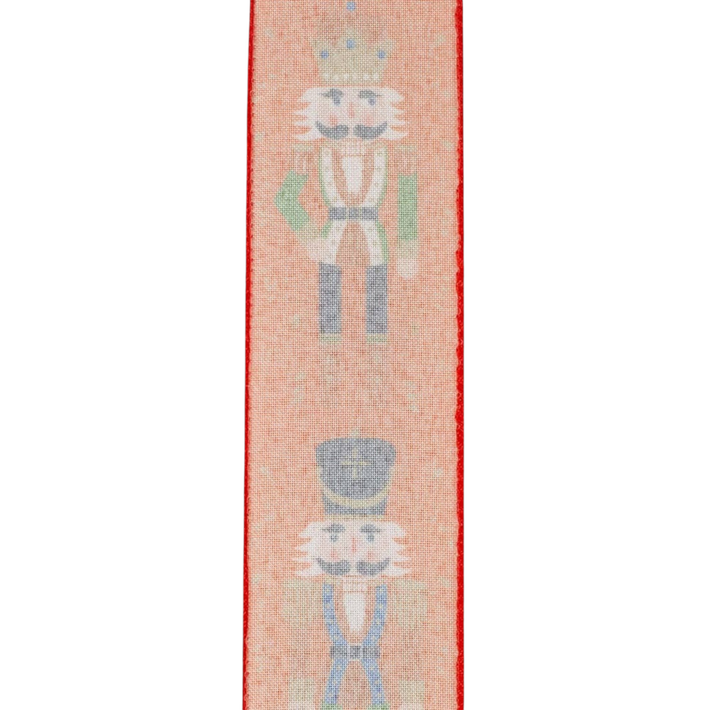The Matthew John Collective red wired edge ribbon featuring whimsical nutcracker figures and scrollwork patterns.