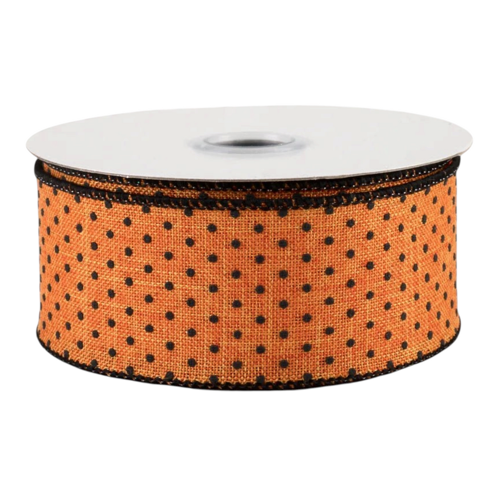 The Matthew John Collective orange royal canvas wired ribbon with black painted swiss dots for Halloween decor.