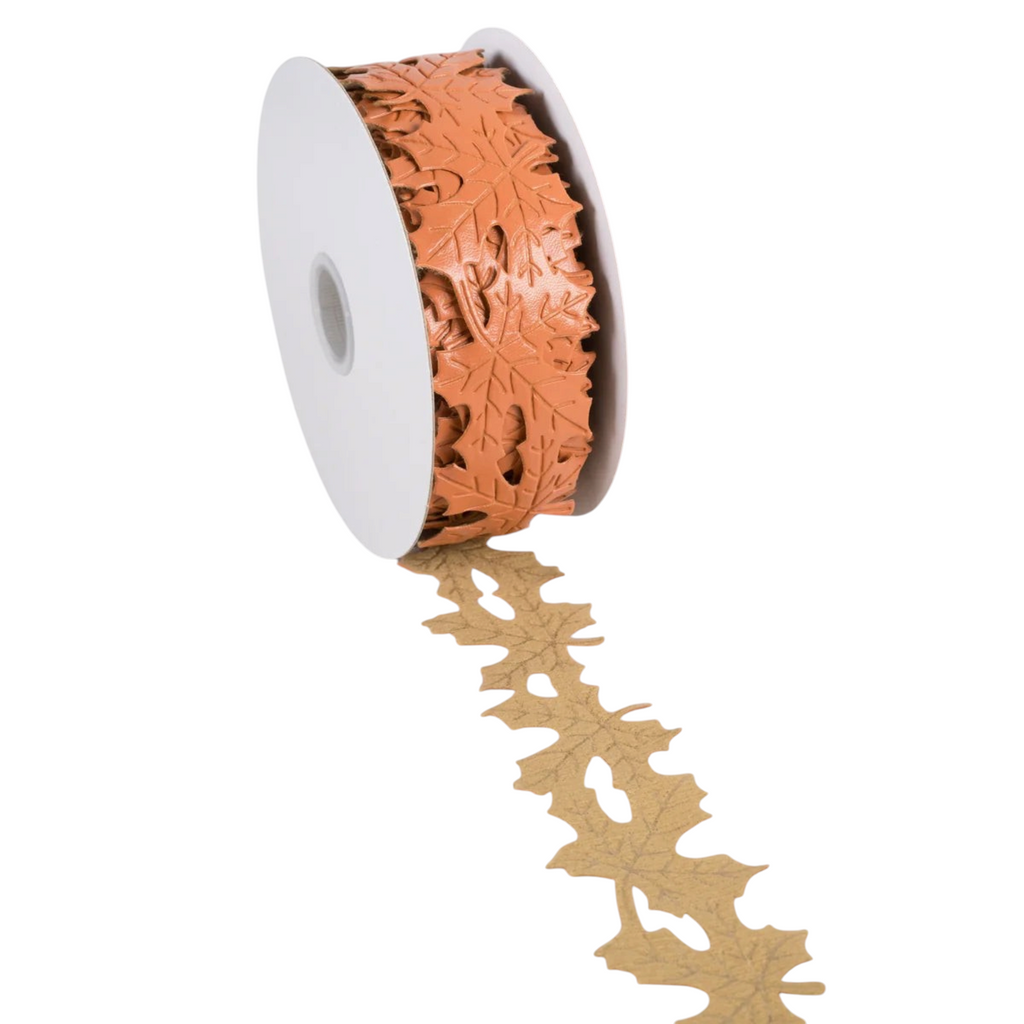 The Matthew John Collective terracotta orange faux leather ribbon with die-cut maple leaf pattern for fall decor.