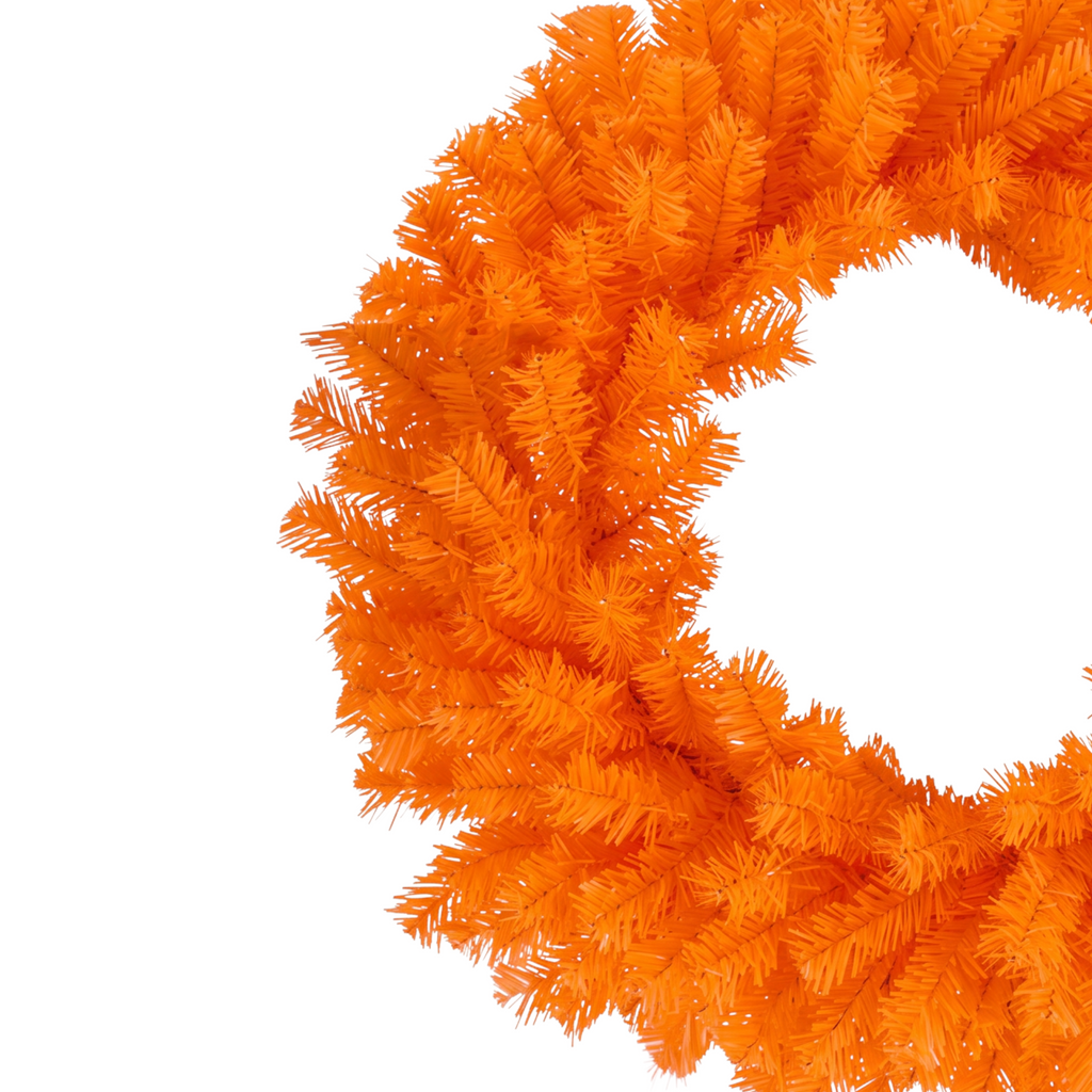 The Matthew John Collective 24-inch vibrant orange artificial pine wreath for fall and Thanksgiving front door decor.
