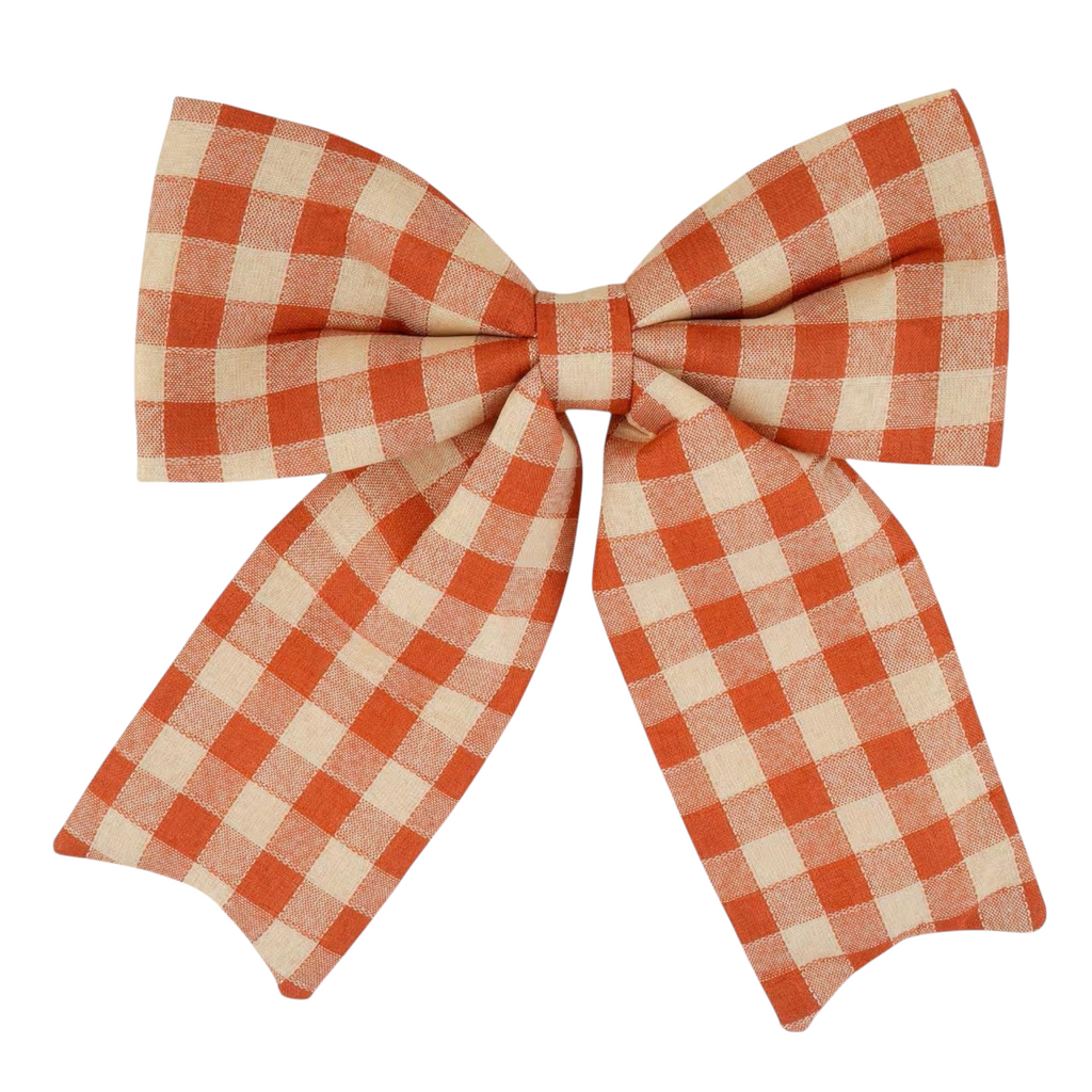 The Matthew John Collective 15-inch orange and cream buffalo check puffy fabric bow for fall home decor.