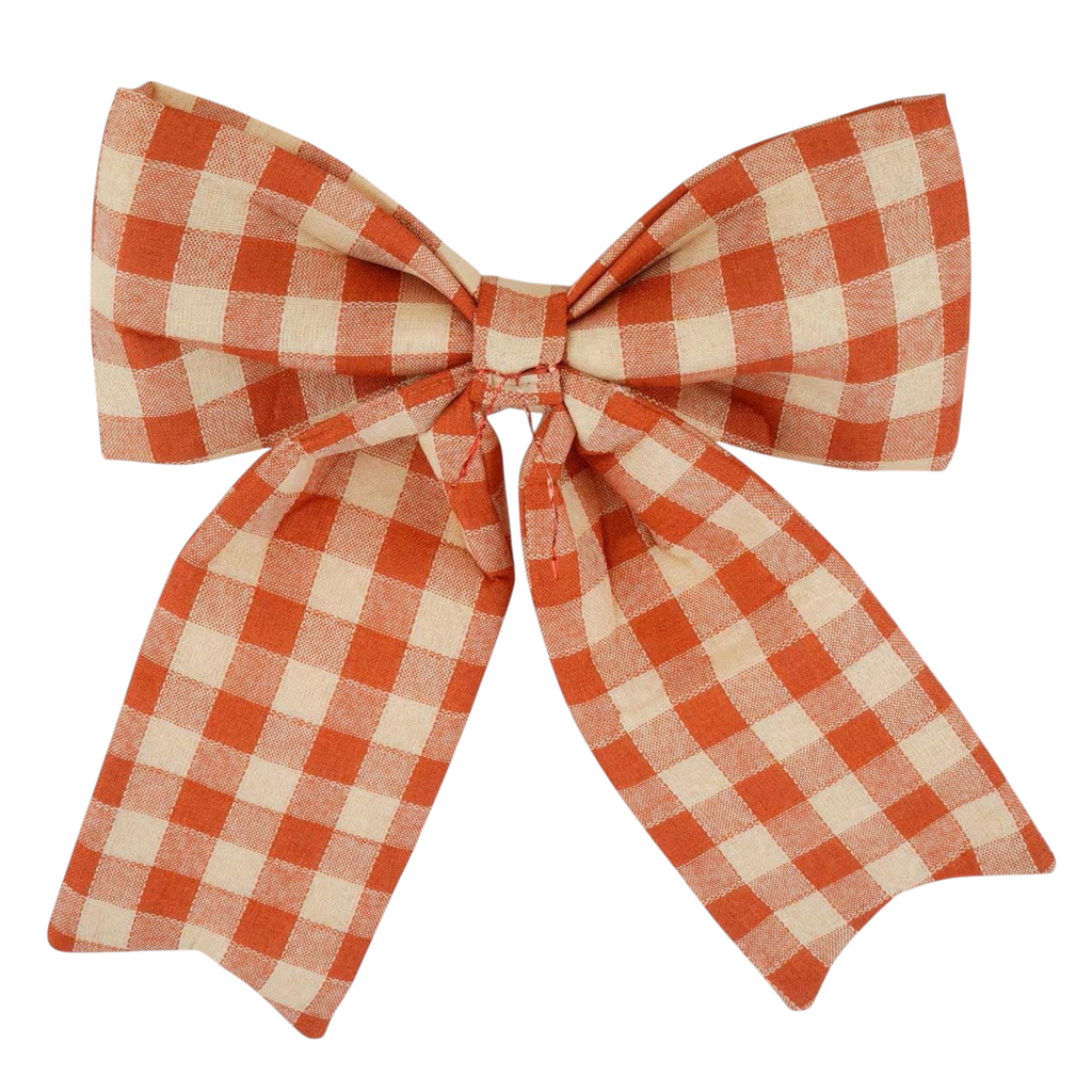 The Matthew John Collective 15-inch orange and cream buffalo plaid puffy fabric bow for fall home decor.