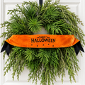 The Matthew John Collective orange satin Halloween wreath banner with black embroidery, bats, and spiders on a wreath.