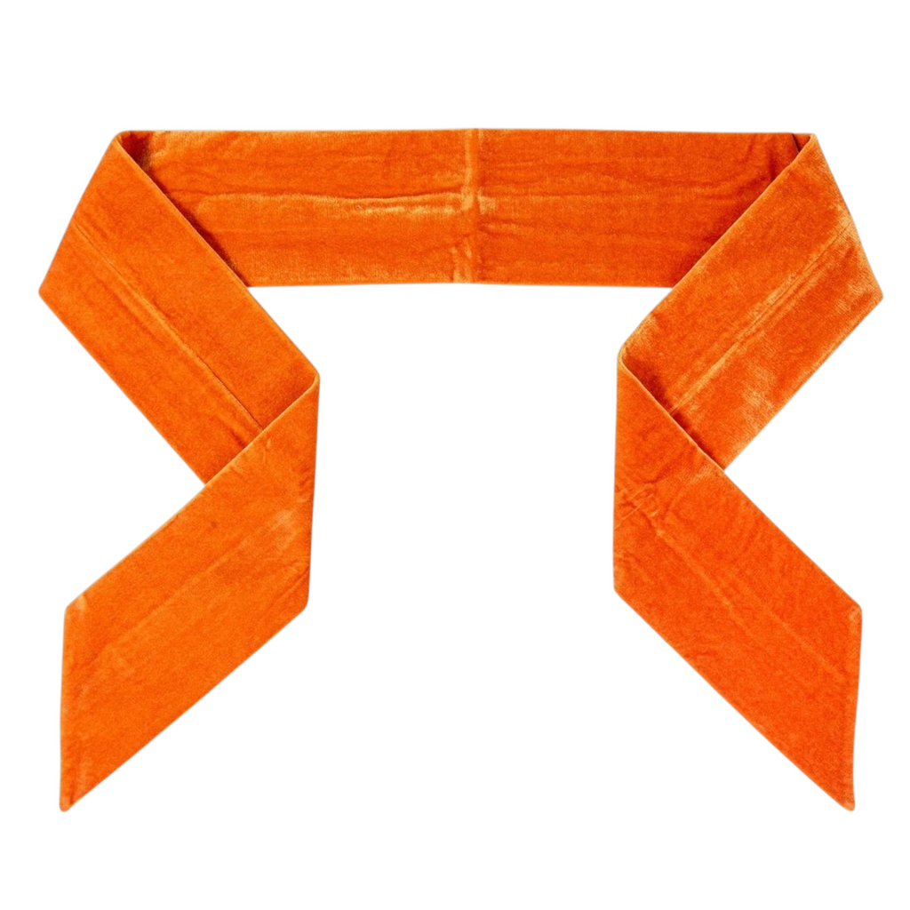 The Matthew John Collective D Stevens plain orange velvet wreath sash with tapered ends for fall decor.