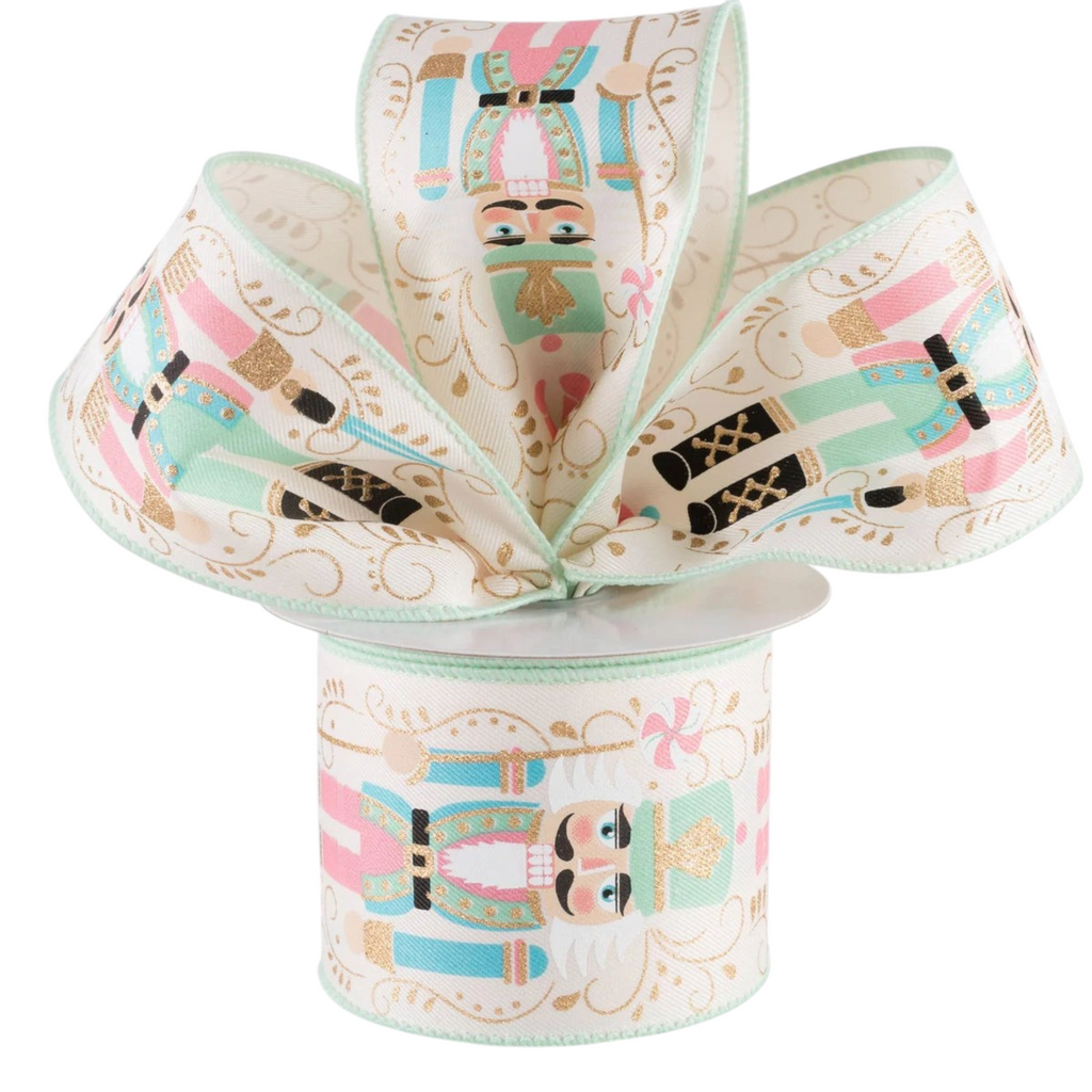 The Matthew John Collective wired Christmas ribbon featuring pastel nutcracker soldiers on an ivory canvas background.