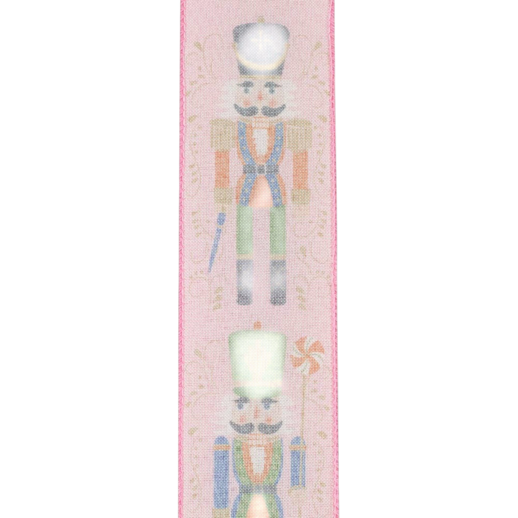 The Matthew John Collective pink wired edge ribbon featuring festive nutcracker figures and delicate scrollwork